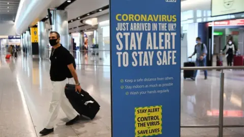 European Photopress Agency Passengers arrive at Heathrow Airport in London, Britain, 30 July 2020.