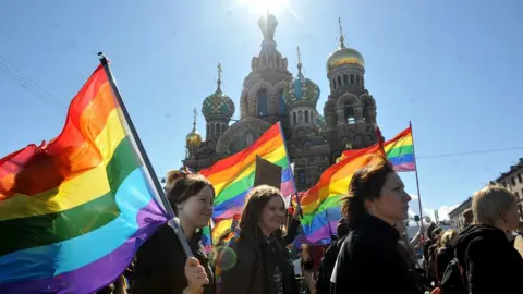 AFP Gay rights activists march in Russia's second city of St Petersburg on 1 May 2013