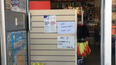 BBC Signs in a shop reminding people of the rules