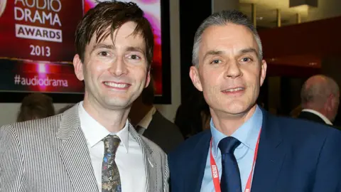 Davie with David Tennant in 2013