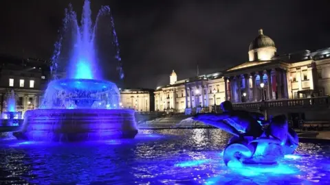 EPA The fountains in Trafalgar Square were illuminated blue for the initiative