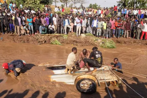 AFP A submerged minibus in a river