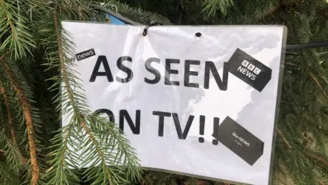 John Devine/BBC A sign reading 'as seen on TV' has been put in the branches