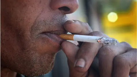 Getty Images Man smokes menthol cigarette