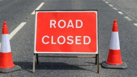 Google A 'road ahead closed' sign