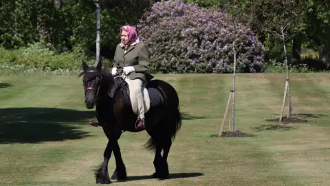 PA Media The Queen rides in the grounds of Windsor castle