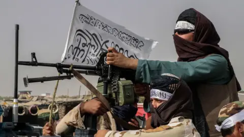 EPA Taliban fighters patrol in Kandahar, 17th August 2021