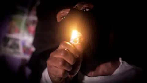 BBC A member of the Black Axe gang, one of Nigeria's most feared "cults"