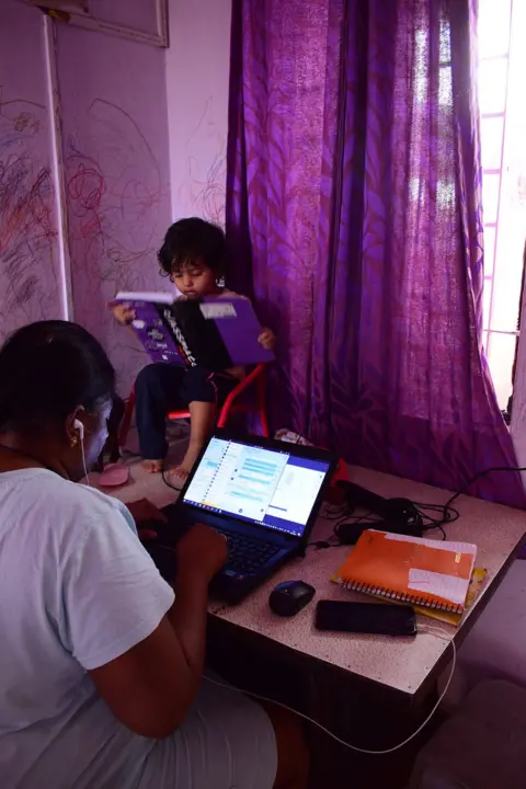 Mathew Pathrose Woman on computer