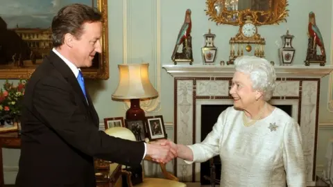 PA Media David Cameron and the Queen