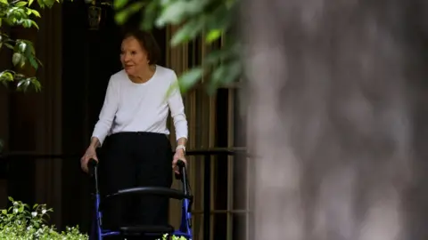 Reuters Former first lady Rosalynn Carter walking with a walking frame