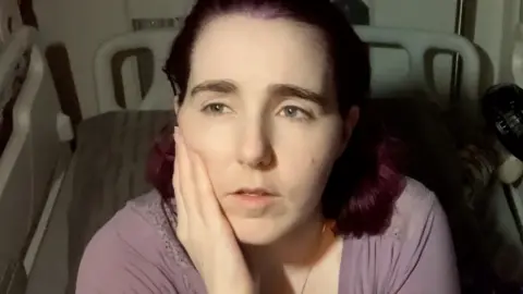 Charlotte in her hospital bed