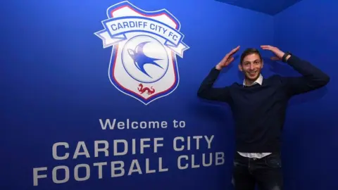 Getty Images Emiliano Sala doing the Ayatollah in front of the Cardiff City logo