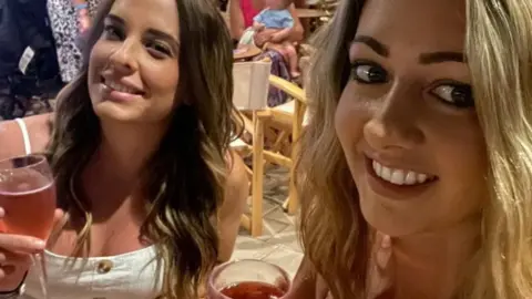 Sophie West Sophie (r) and her friend holidaying with Sophie's family in Crete