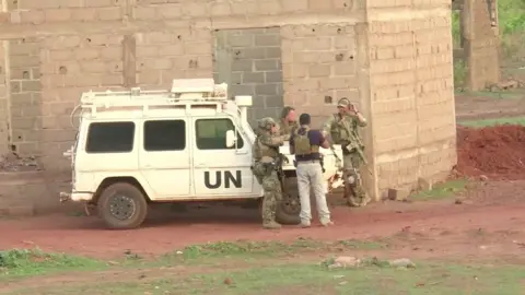 Reuters French soldiers stand around a United Nations vehicle following an attack where gunmen stormed Le Campement Kangaba in Dougourakoro