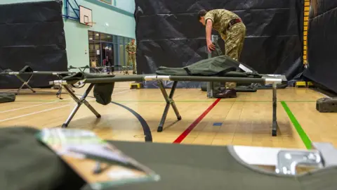 Ministry of Defence Soldier builds bed