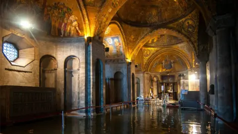 Getty Images A view inside the flooded St Mark's Basilica in Venice during an exceptional high tide, 13 November 2019