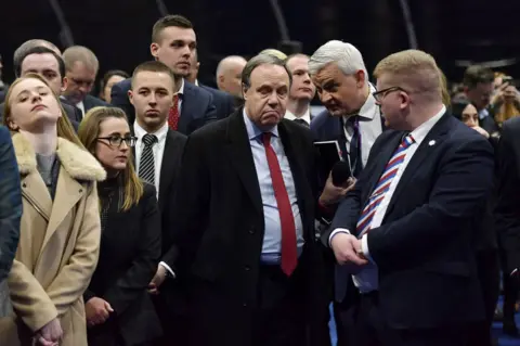 Charles McQuillan / Getty Images DUP Westminster leader Nigel Dodds reacts after losing his seat as Sinn Fein candidate John Finucane is declared the winner in the Belfast