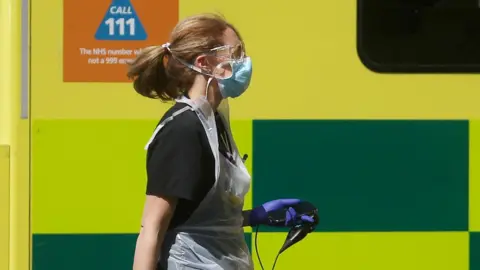 Reuters Nurse in PPE