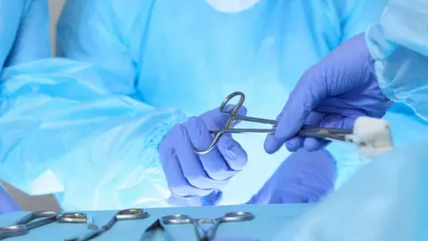 Getty Images Doctors carrying out surgery