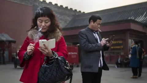 Getty Images People using mobile phones in China