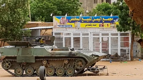 AFP via Getty Images A Sudanese army vehicle at a checkpoint in Khartoum. Photo: 30 April 2023