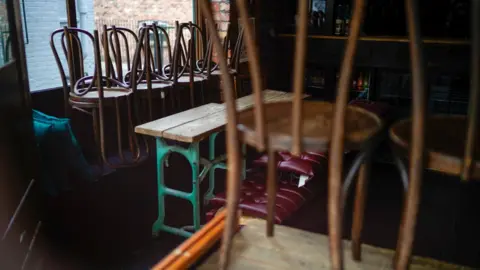 Getty Images Chairs on table in restaurant