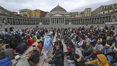 EPA Muslims gathered on a square in Naples, Italy.