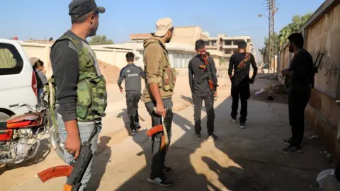 EPA SDF forces prepare to counter Turkey Ras al-Ain 10 Oct