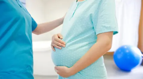 Getty Images Midwife and woman