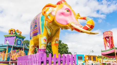 Hello Content for Camp Bestival Shropshire A brightly coloured elephant statue