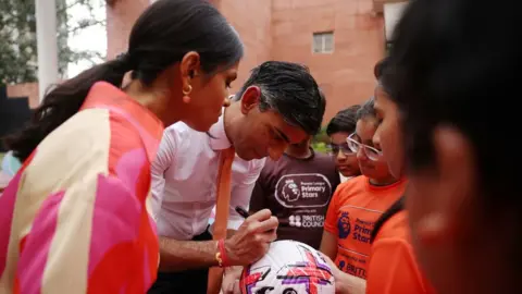 PA Media Rishi Sunak and his wife Akshata Murty