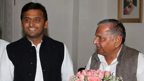 Getty Images Samajwadi Party leader Mulayam Singh Yadav (R) and his son Akhilesh Yadav meet with Governor of Uttar Pradesh Banwari Lal Joshi at the governor's house to stake a claim of forming a government on March 7, 2012 in Lucknow, India.