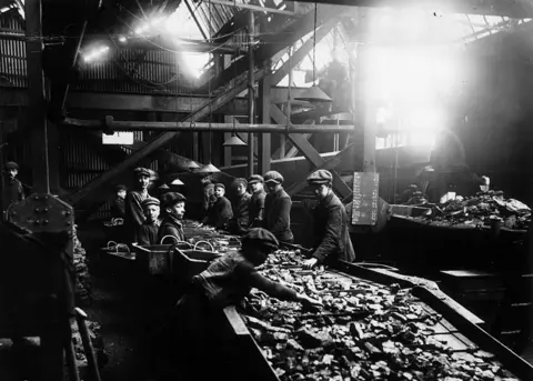 Topical Press/Hulton Archive Boys working at cleaning coal at a pit in Bargoed in 1910