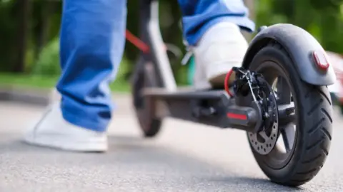 Getty Images Generic image of person on generic e-scooter