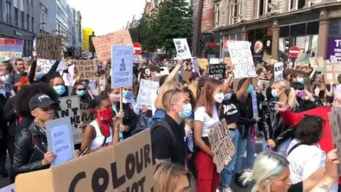 BBC A large crowd protested in Belfast on Wednesday over the death of George Floyd