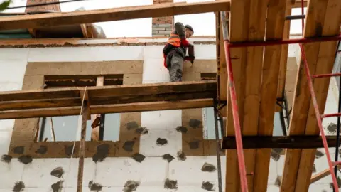 State Restoration Agency Work is under way on rebuilding a badly damaged Soviet apartment block in Bucha