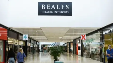 UHD Beales department store sign inside the Dolphin Centre shopping mall