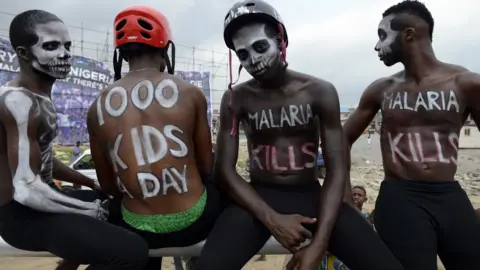 Getty Images People protesting in Nigeria about amalria deaths