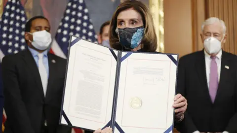 EPA Speaker of the House Nancy Pelosi holds the signed Article of Impeachment against US President Donald J. Trump