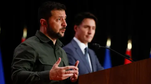 Reuters Ukraine's President Volodymyr Zelensky speaks, as he attends a joint press conference with Canadian Prime Minister Justin Trudeau in Ottawa