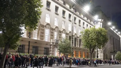 PA Media Members of the public in the queue in Westminster on the evening of 18 September to see the lying in state