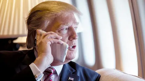 The White House Image from White House flickr account of President Trump using a mobile phone on Jan 26 2017