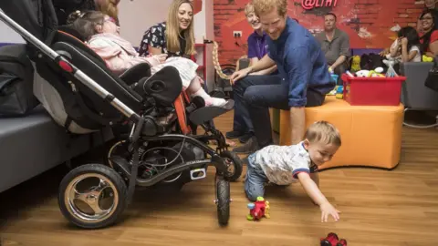 Danny Lawson/PA Prince Harry meets Audrey Frantzich, her parents Herman and Louise and brother Tommy during a visit to Leeds Children's Hospital