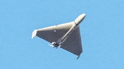 Reuters Russian explosive drone - believed by Ukrainian authorities to be an Iranian-made Shahed-136 - is seen flying over Kyiv, Ukraine, on 17 October 2022