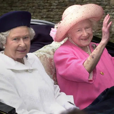 PA Media Queen Elizabeth II (left) and the Queen Mother leaving church by horse-drawn carriage on the Sandringham Estate, Norfolk