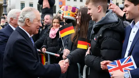 Reuters The King met with crowds near the Brandenburg Gate