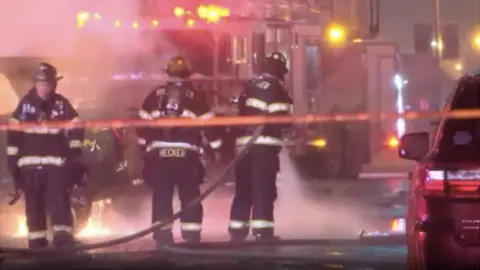 CBS Firefighters extinguish car crash blaze