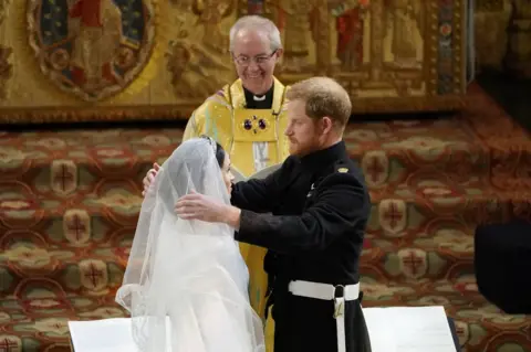 PA Prince Harry and Meghan Markle in St George's Chapel at Windsor Castle during their wedding service