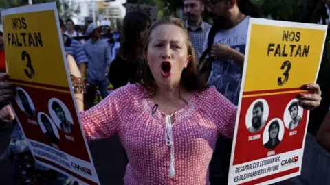 AFP Relatives and friends of three missing students protest in Guadalajara, Jalisco state. Photo: 19 April 2018